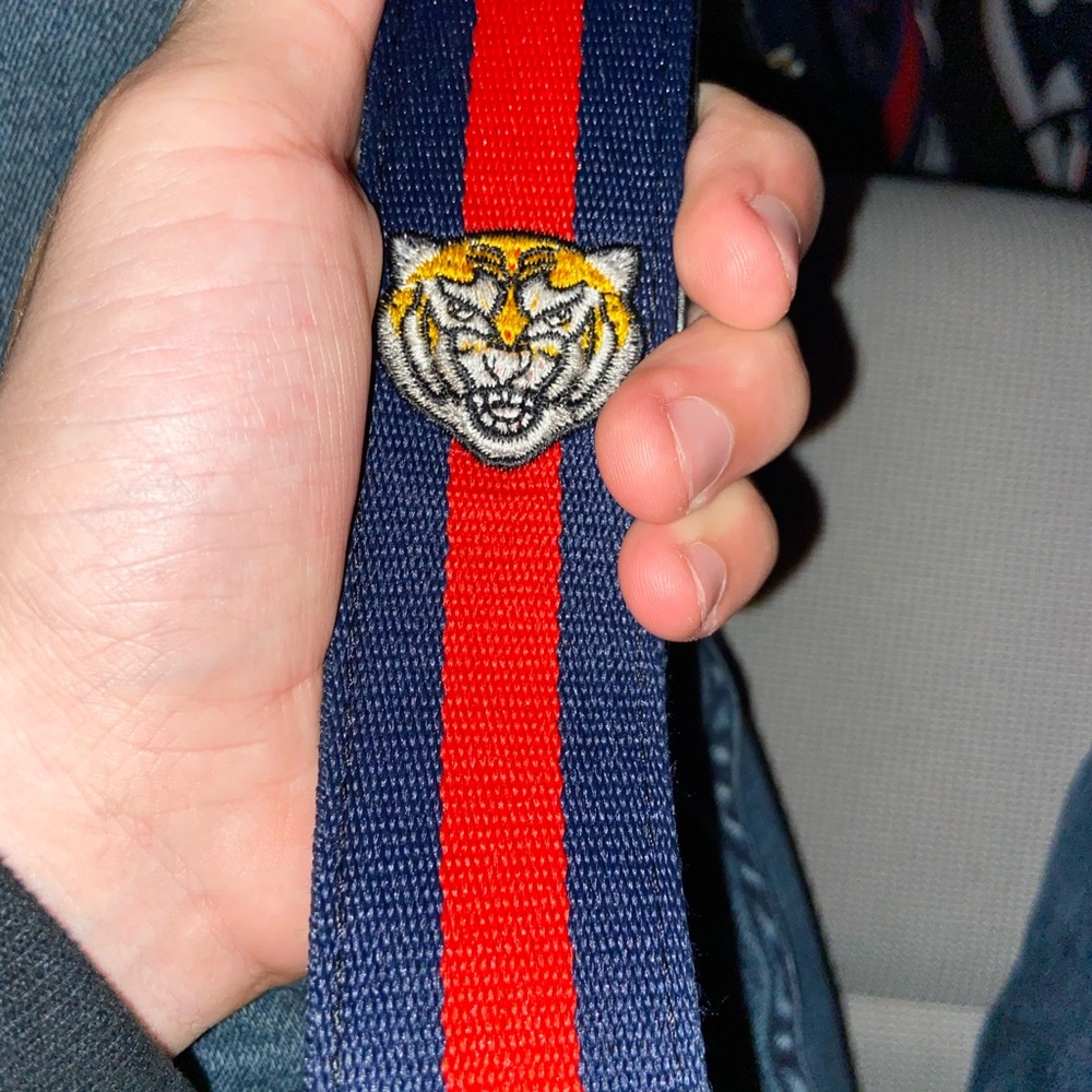 Gucci belt red, navy blue, and tiger face print.
